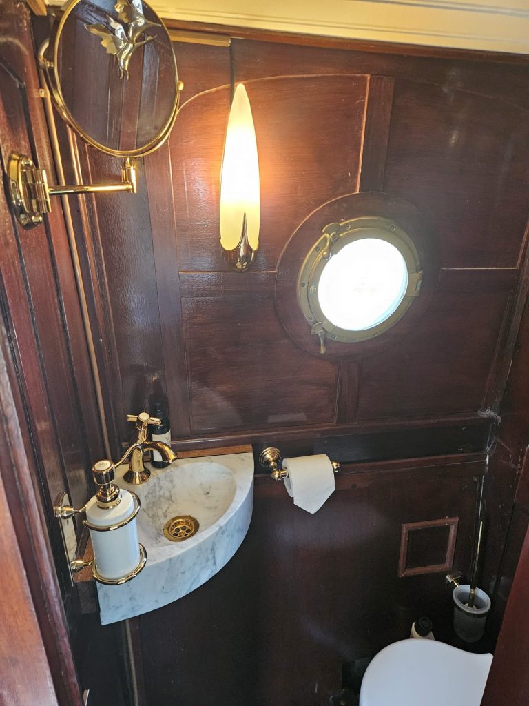 classic canal boat with restroom amsterdam