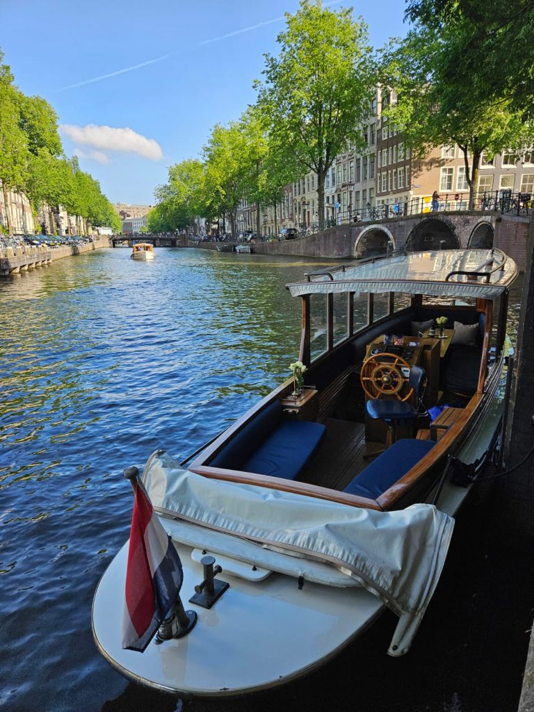private canal cruise amsterdam small open boat